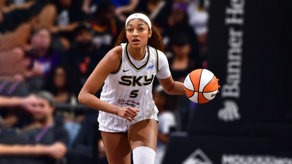 AAngel Reese of the Chicago Sky dribbles the ball during the game against Phoenix Mercury.