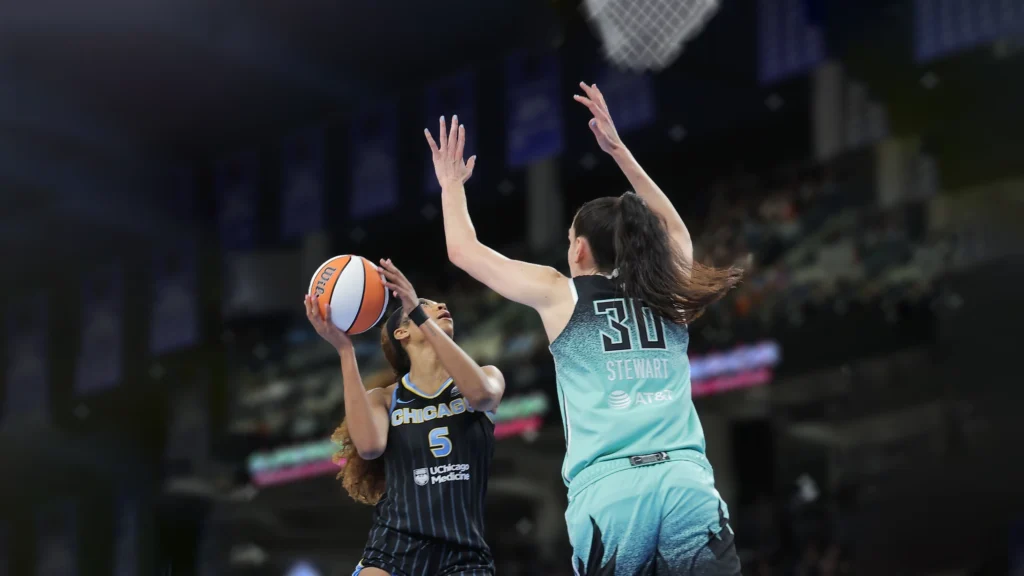 Breanna Stewart of the New York Liberty guards Angel Reese of the Chicago Sky.