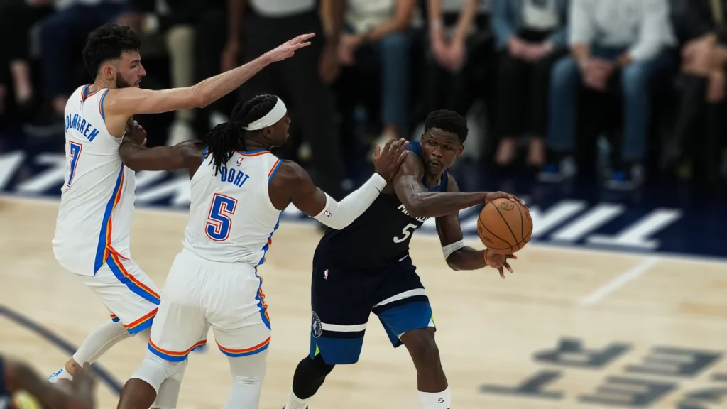 Anthony Edwards of the Minnesota Timberwolves passes the ball during the game against the Oklahoma City Thunder.