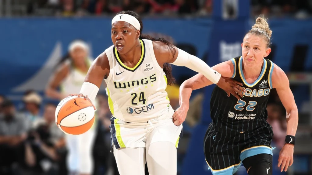 Arike Ogunbowale of the Dallas Wings dribbles the ball during the game against the Chicago Sky.