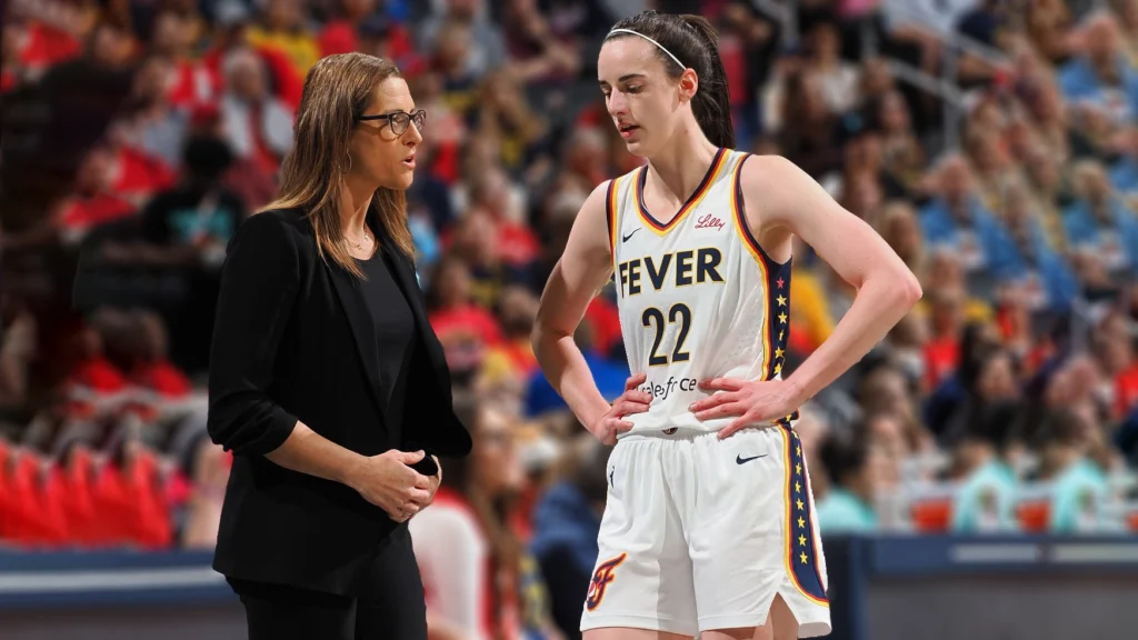 Caitlin Clark and Head Coach Stephanie White of the Indiana Fever drives to the basket during the game against the New York Liberty.