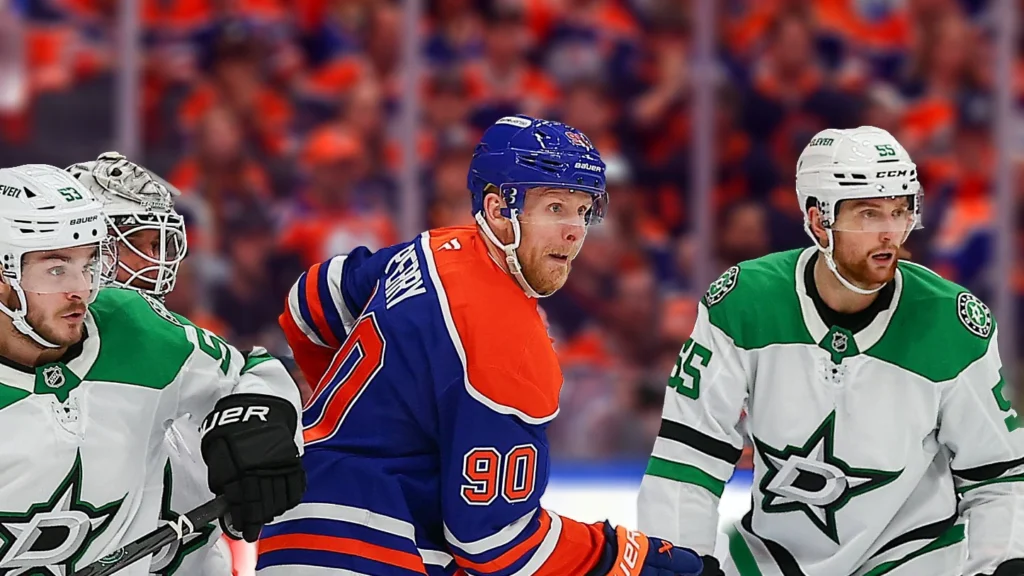 Edmonton Oilers Winger Corey Perry (90) is checked by Dallas Stars Right Wong Wyatt Johnson (53) in the third period of game four in Stanley Cup Playoffs Conference Finals.