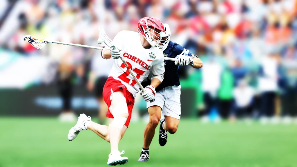 Hugh Kelleher of Cornell Big Red defended by Brooke Long of Penn State Nittany Lions during the 2025 NCAA Div I Men's Lacrosse Semifinal match.