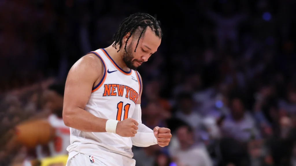 Jalen Brunson of New York Knicks pumps his fists after his basket.