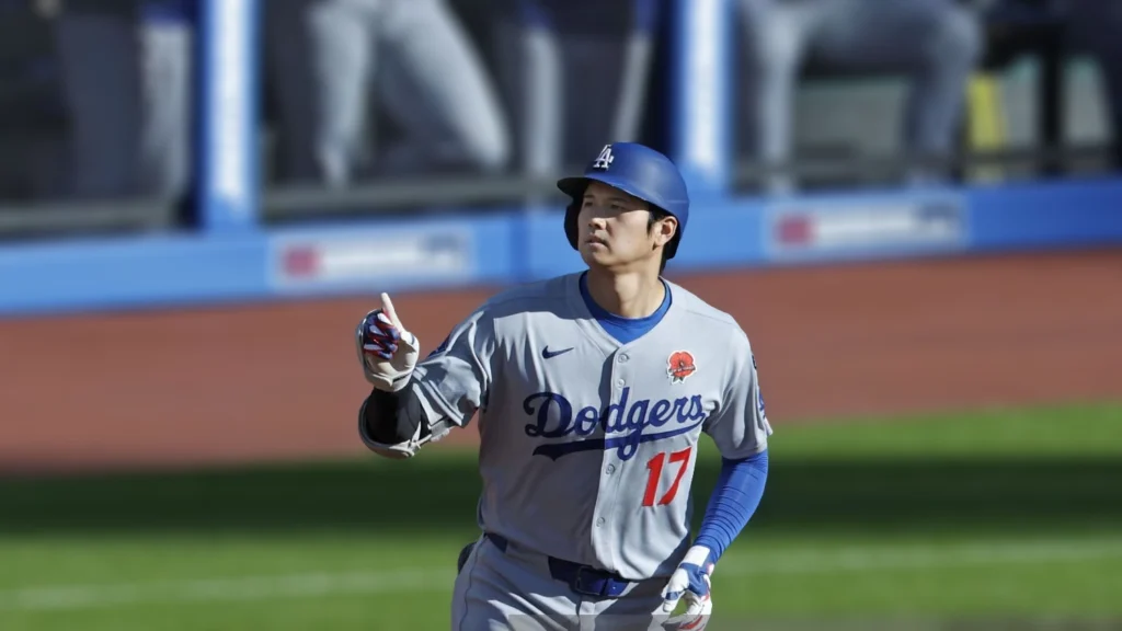 Los Angeles Dodgers designated hitter Shohei Ohtani rounds the bases after hitting a leadoff home run in the first inning of a baseball game against the Cleveland Guardians