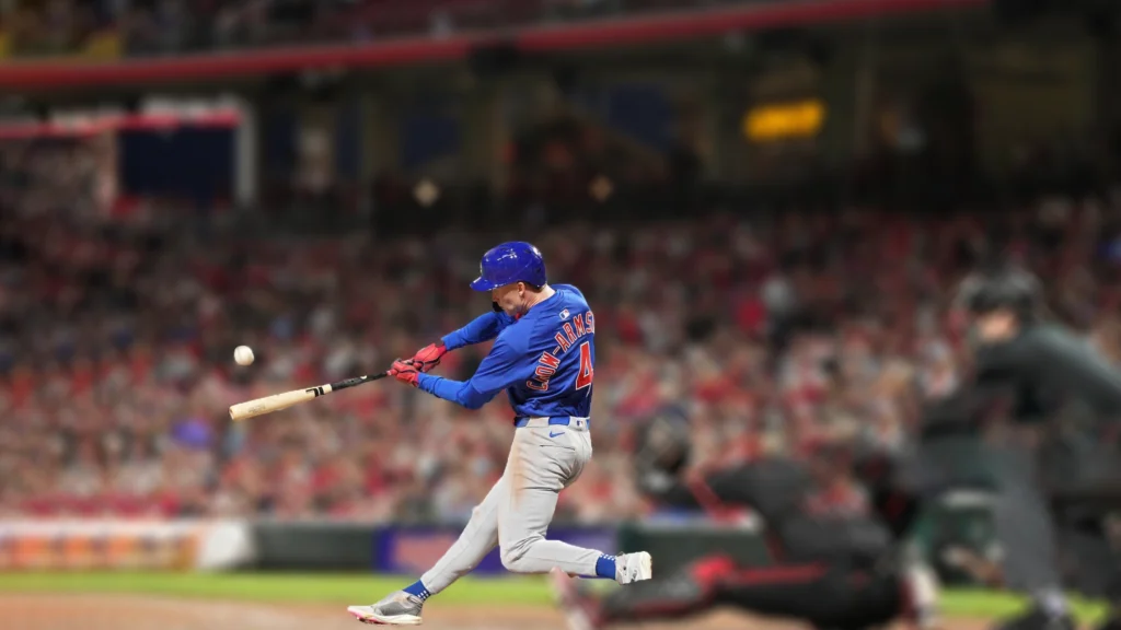 Pete Crow-Armstrong of the Chicago Cubs hits a grand slam during the seventh inning of a baseball game against the Cincinnati Reds.