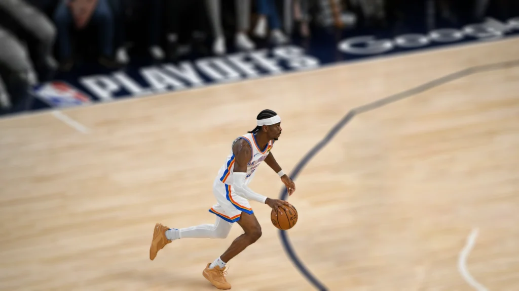 Shai Gilgeous-Alexander of the Oklahoma City Thunder dribbles the ball during Game Four of the Western Conference Finals against Minnesota Timberwolves.