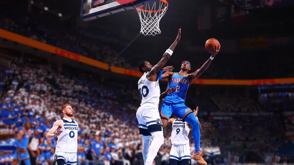 : Shai Gilgeous-Alexander of the Oklahoma City Thunder drives to the basket during the game against the Minnesota Timberwolves during Game Five of the Western Conference Finals.