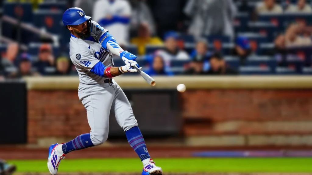 Teoscar Hernández of the Los Angeles Dodgers hitting a pitch during the game between the Los Angeles Dodgers and the New York Mets.
