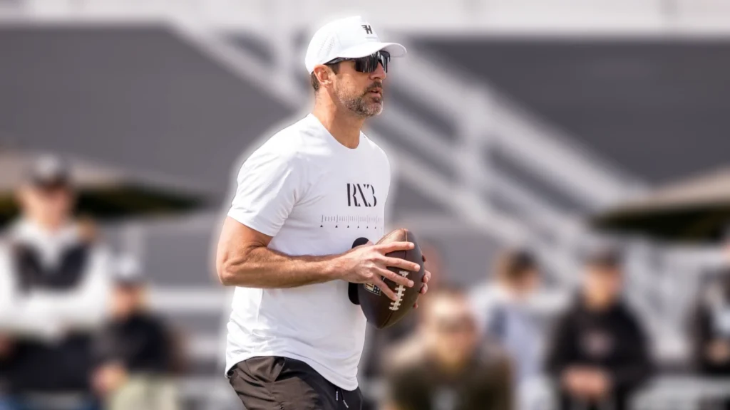 NFL Quarterback Aaron Rodgers ready to throw a football during RX3's Celebrity Flag Football Tournament.