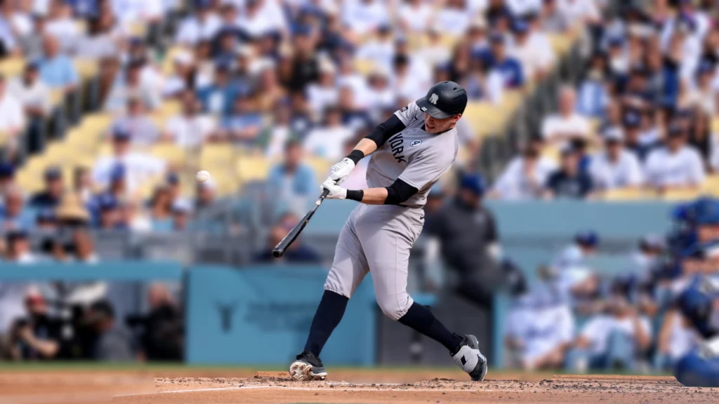 Ben Rice of the New York Yankees hits a two-run home run during the third inning against the Los Angeles Dodgers.