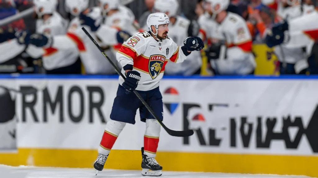 Brad Marchand of the Florida Panthers skates by the bench to celebrate a third period goal against the Edmonton Oilers in Game Five of the 2025 Stanley Cup Final.