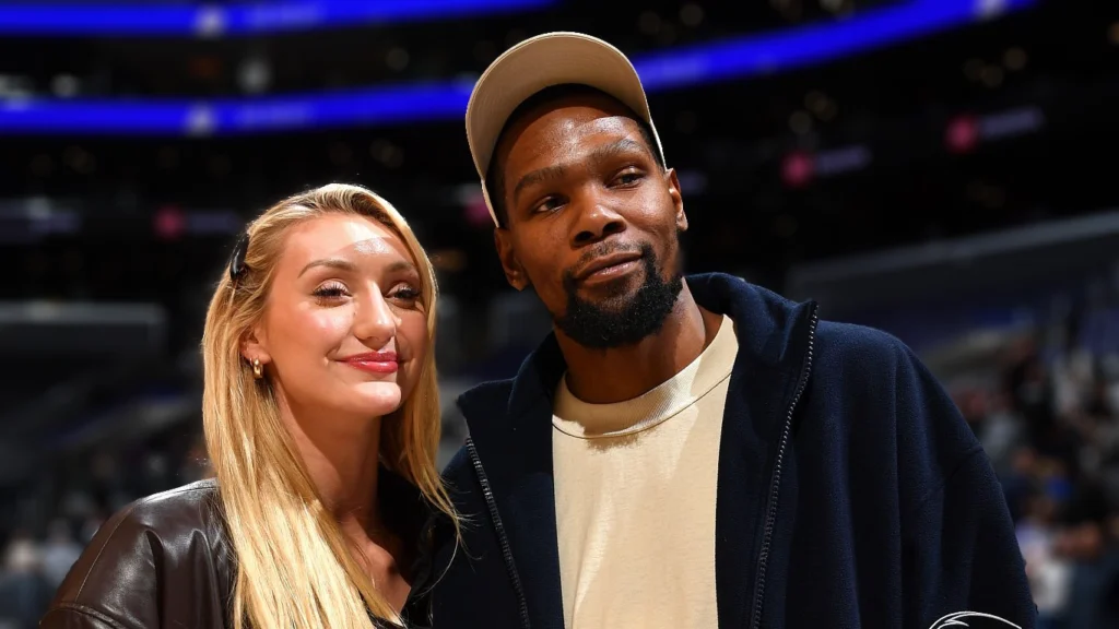 Cameron Brink of the Los Angeles Sparks poses for a photograph with Kevin Durant.