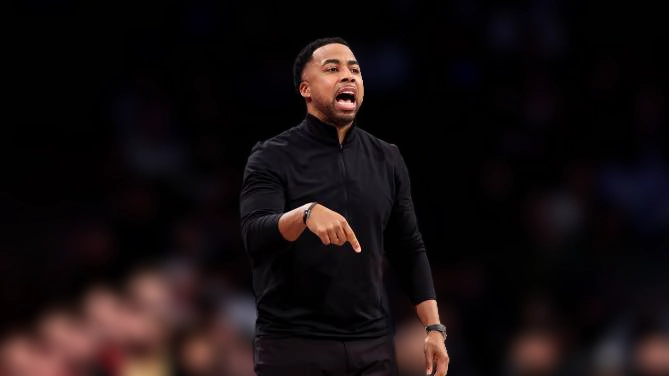 Associate head coach Johnnie Bryant of the Cleveland Cavaliers reacts against the Brooklyn Nets.