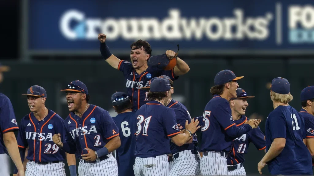 TSA players lift up UTSA infielder Norris McClure after winning the NCAA Division I Regional game against Texas Longhorns.