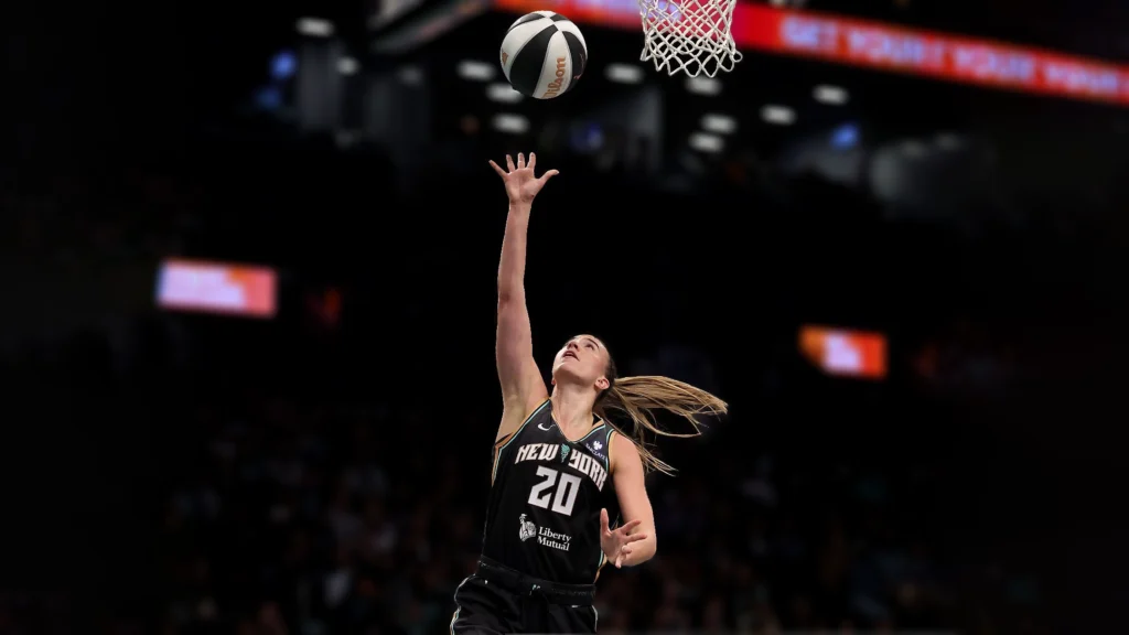 Sabrina Ionescu of the New York Liberty heads for the net in the first half against the Connecticut Sun.