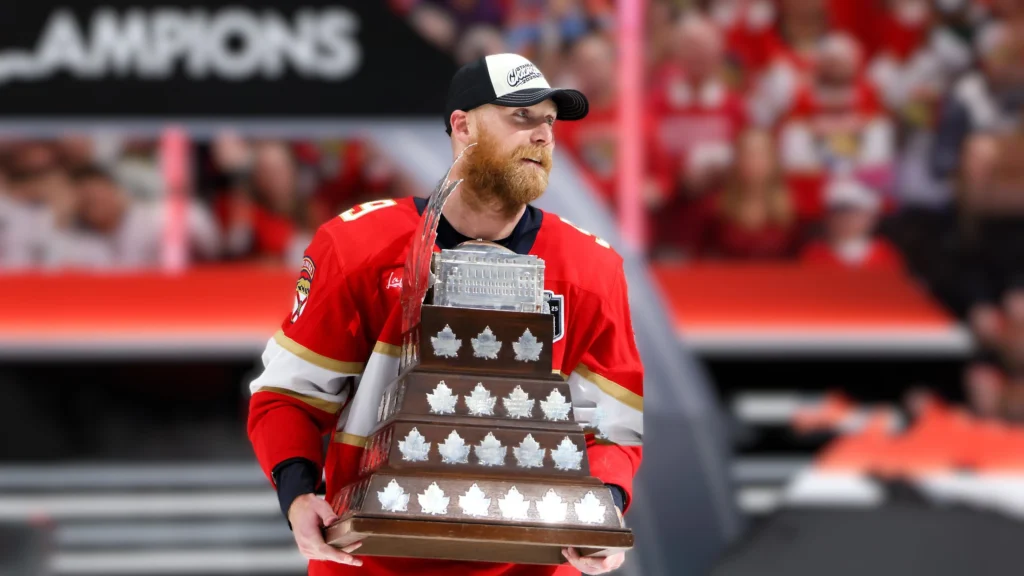 Sam Bennett proudly holds the Conn Smythe Trophy after being named the MVP of the 2025 Stanley Cup Playoffs, leading the Florida Panthers to their second consecutive championship.