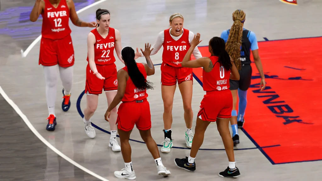 The Indiana Fever celebrate a pivotal moment during their dominant second-half performance against the Atlanta Dream on July 11, 2025, securing a 99-82 victory.